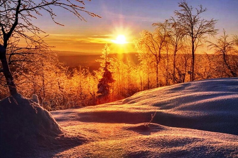 Snow-covered Hill at Sunrise