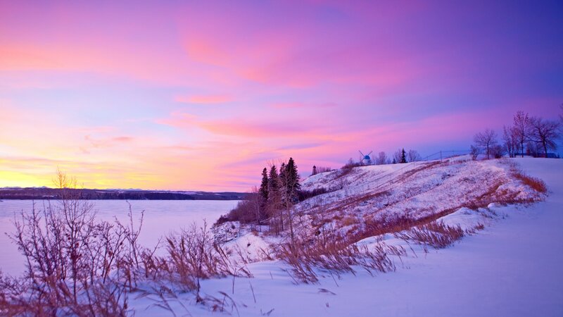 Snow-covered Hill by Lake