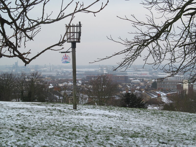Snow-covered Hill with City View