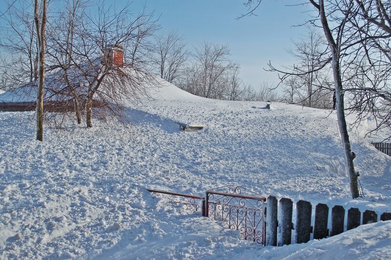 Snow-covered Hill with Gate