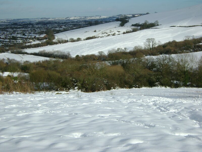 Snow-covered hills and village