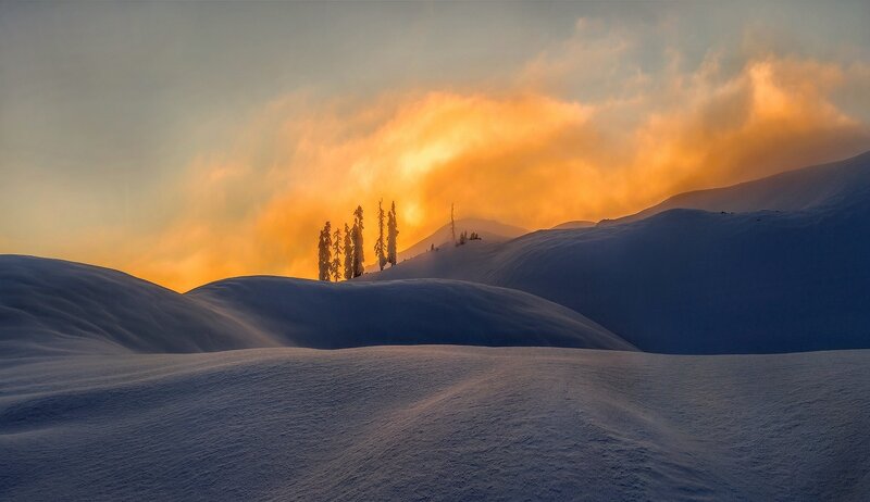 Snow-covered Hills at Sunset — Orange, Dramatic