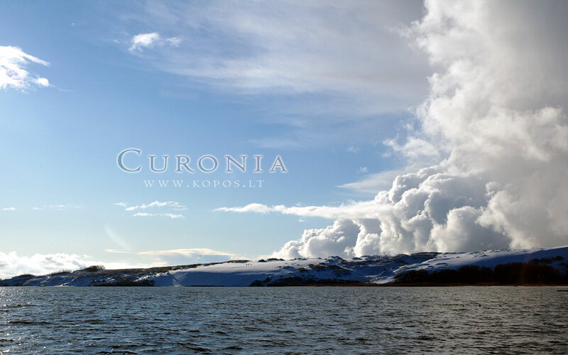 Snow-covered Hills by Lake
