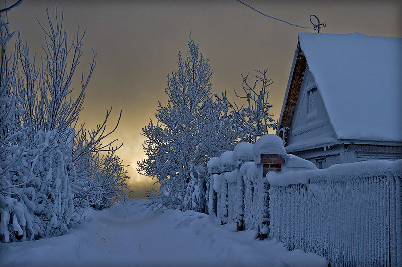 Snow-covered House and Fence