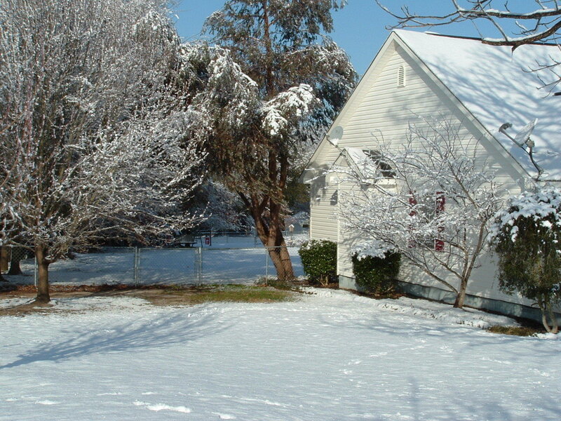 Snow-covered house and yard