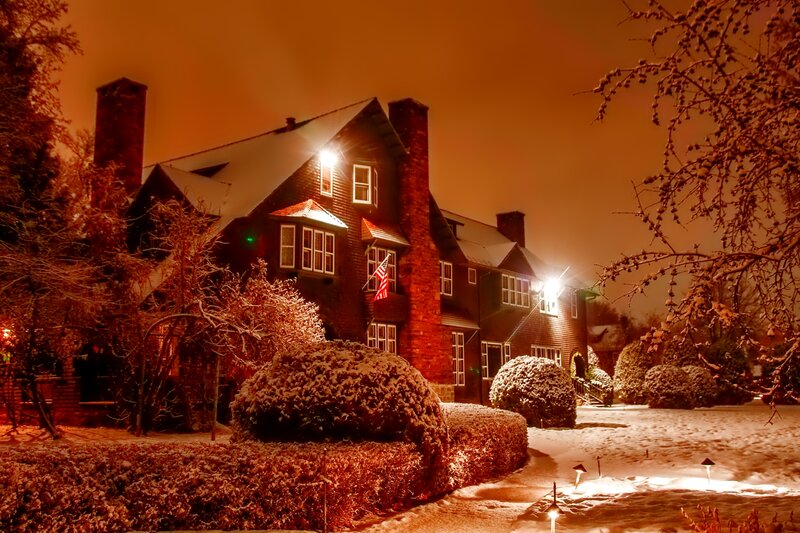Snow-covered House at Night — Orange, Cozy