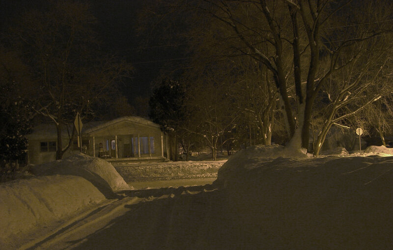 snow-covered house at night