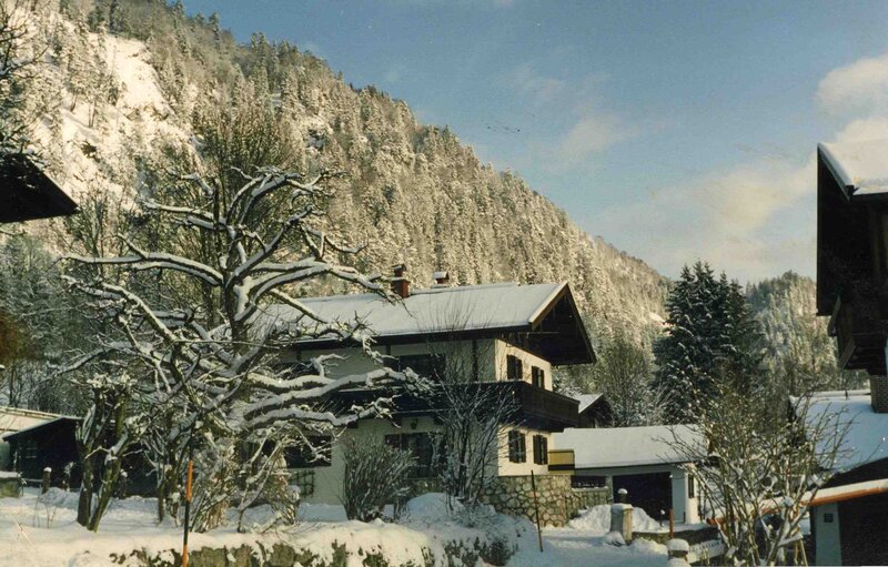 Snow-covered House in Mountains