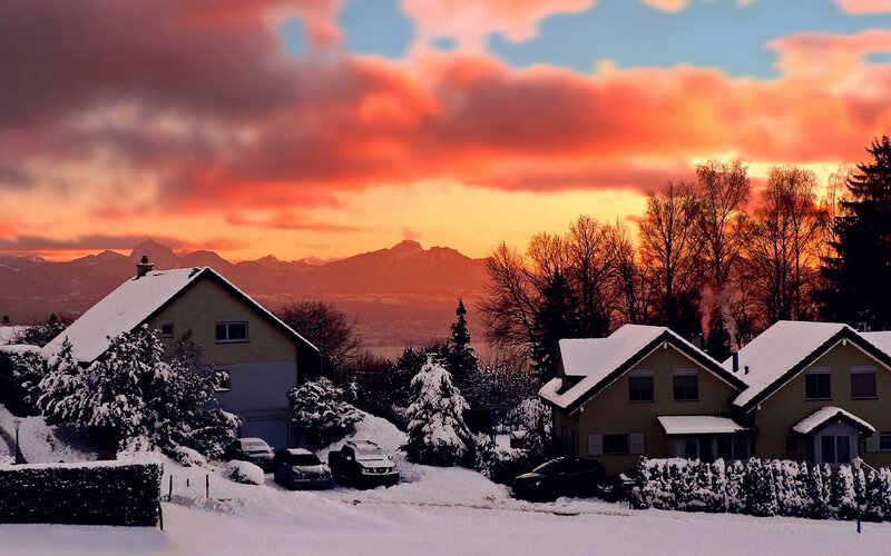 Snow-covered Houses at Sunset — Orange, Dramatic, Photograph, Mountains