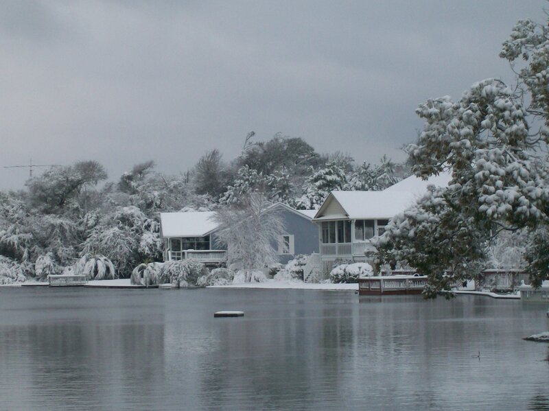 Snow-covered Houses by Lake