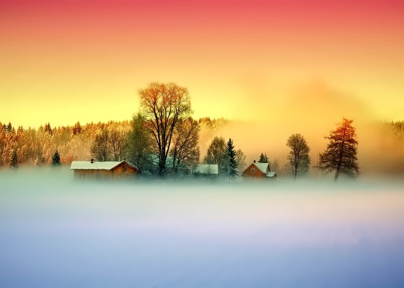 Snow-covered Houses in Fog