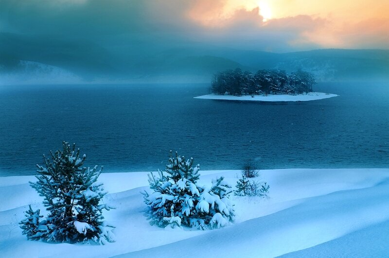 Snow-covered Island in Lake — Blue