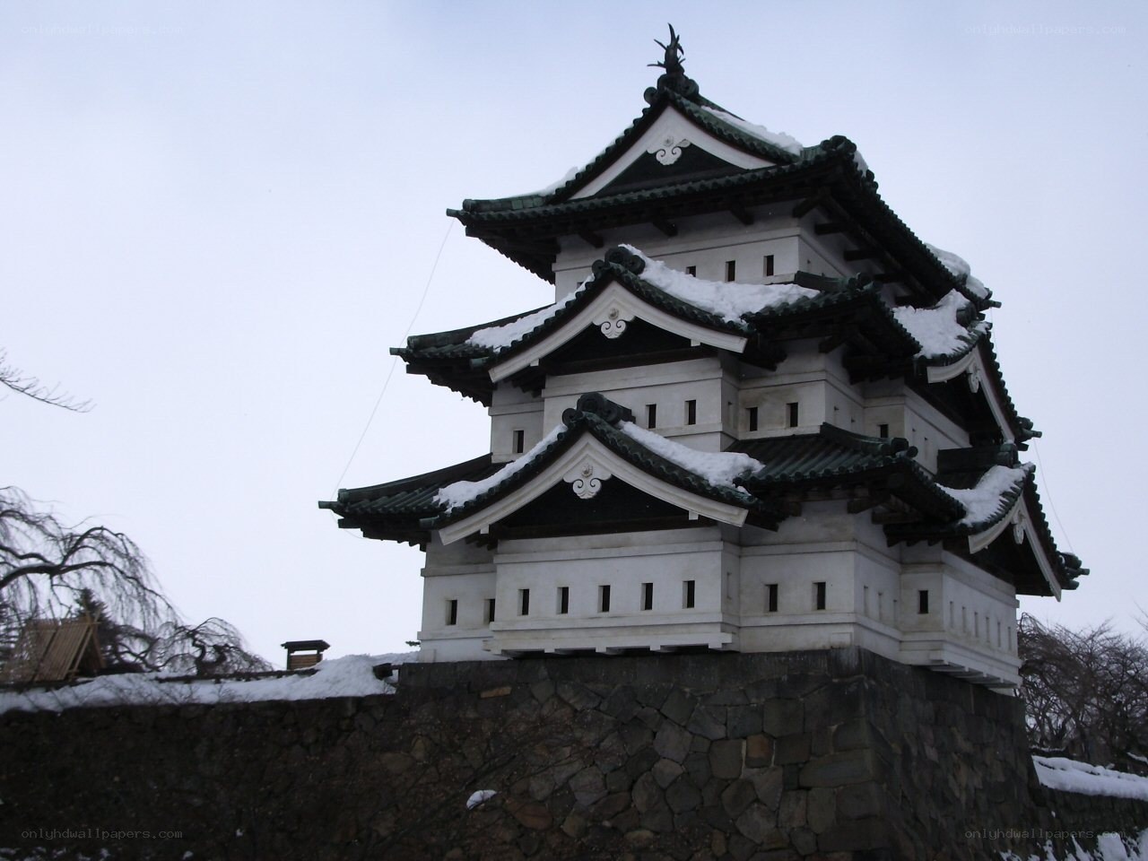 Snow-covered Japanese castle tower