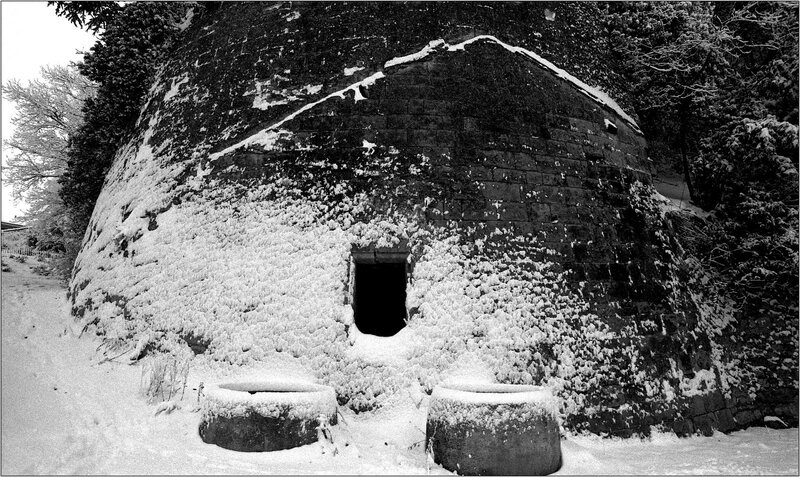 Snow-covered kiln in winter