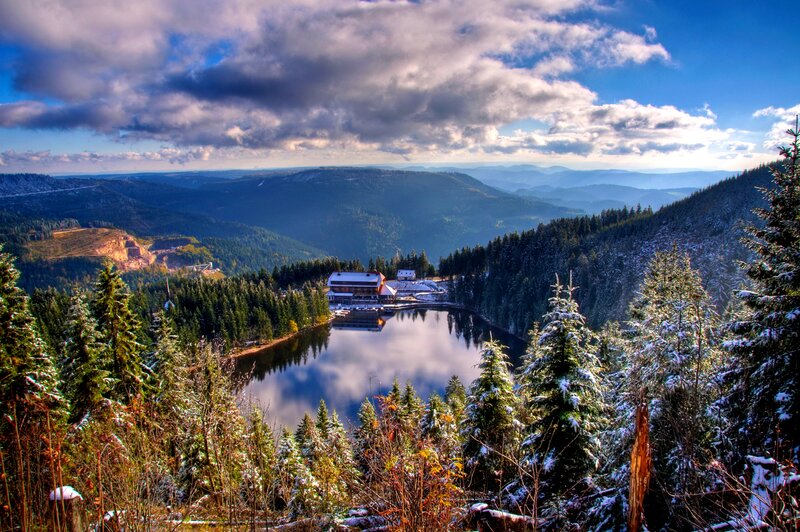 Snow-covered Lake and Cabin