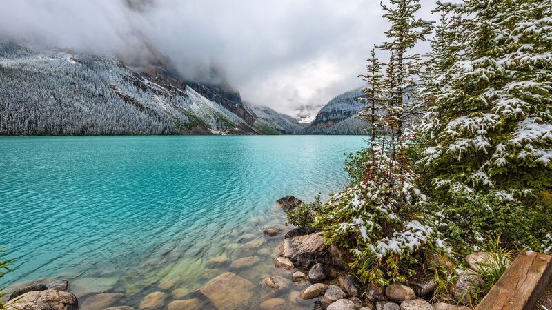 Snow-covered Lake and Mountains — Blue, Serene, Winter, Photograph, Trees, Rocks