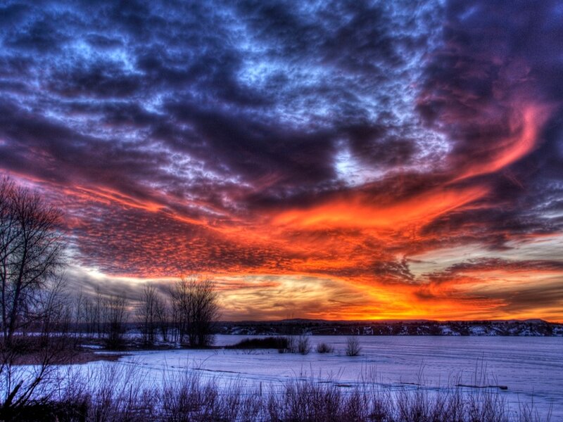 Snow-covered Lake at Sunset