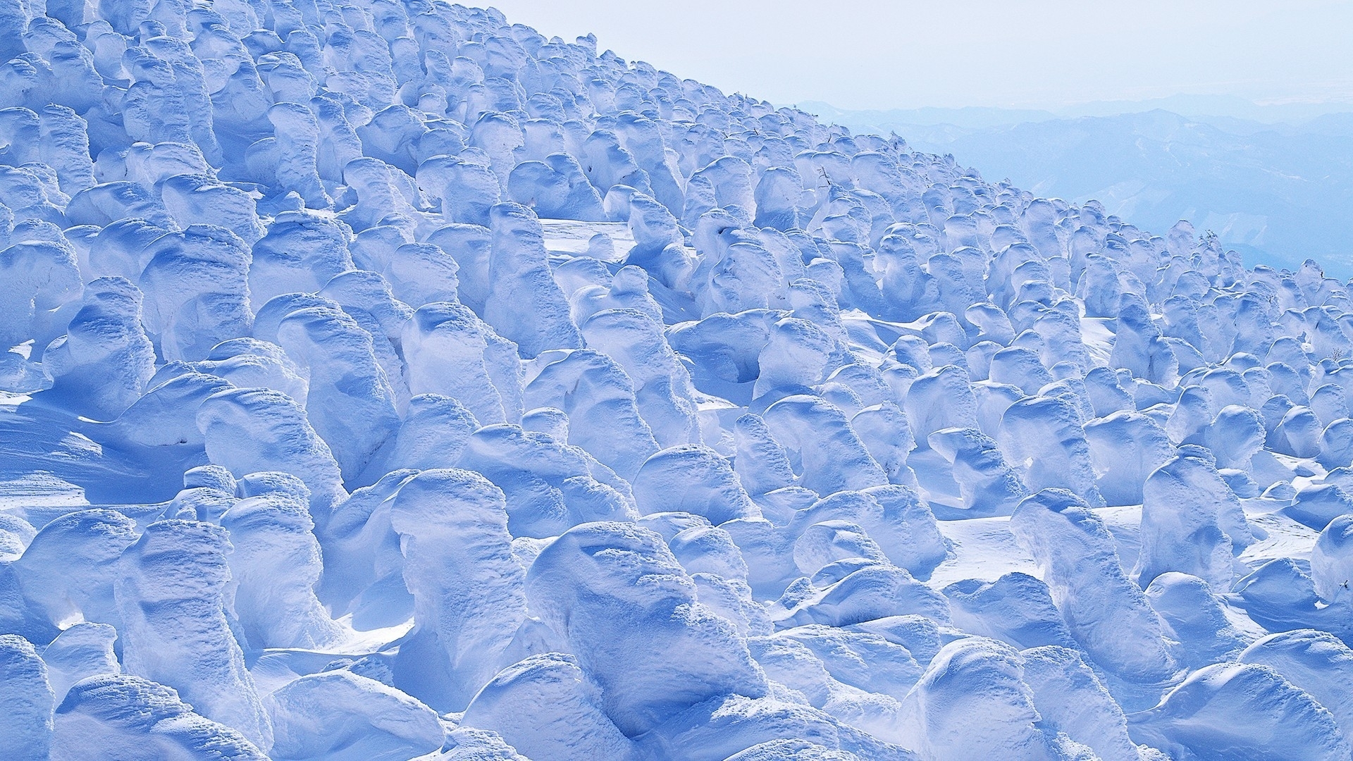 Snow-covered landscape with ice formations