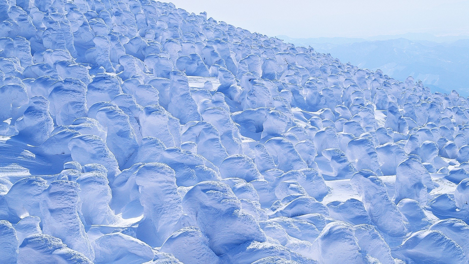 Snow-covered landscape with ice formations