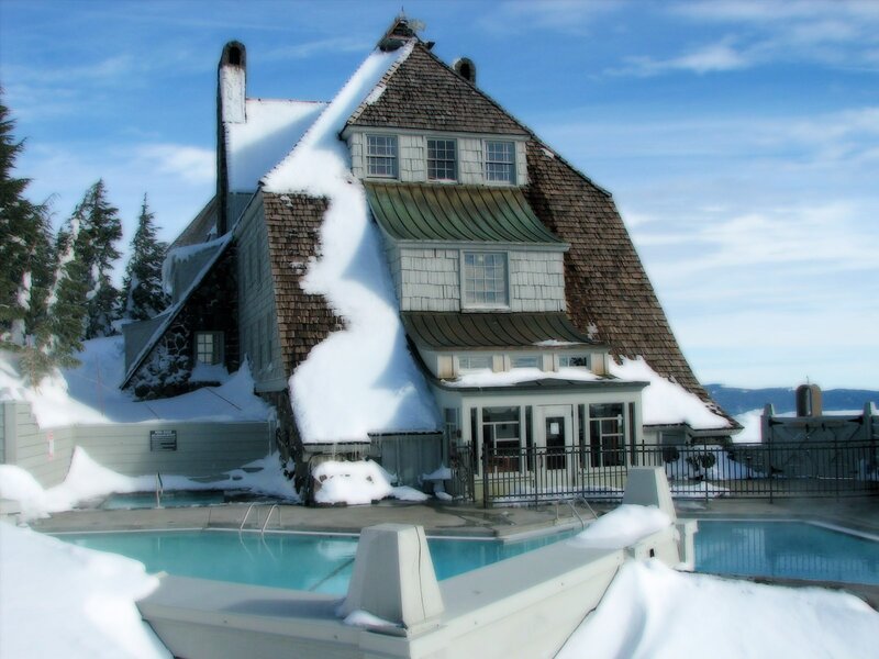 Snow-covered lodge with outdoor pool