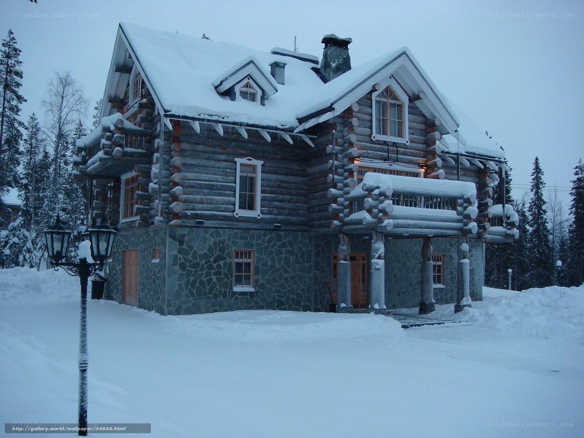 Snow-covered log cabin