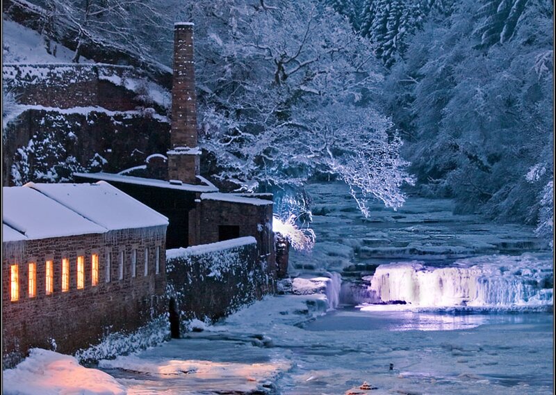 Snow-covered Mill by River