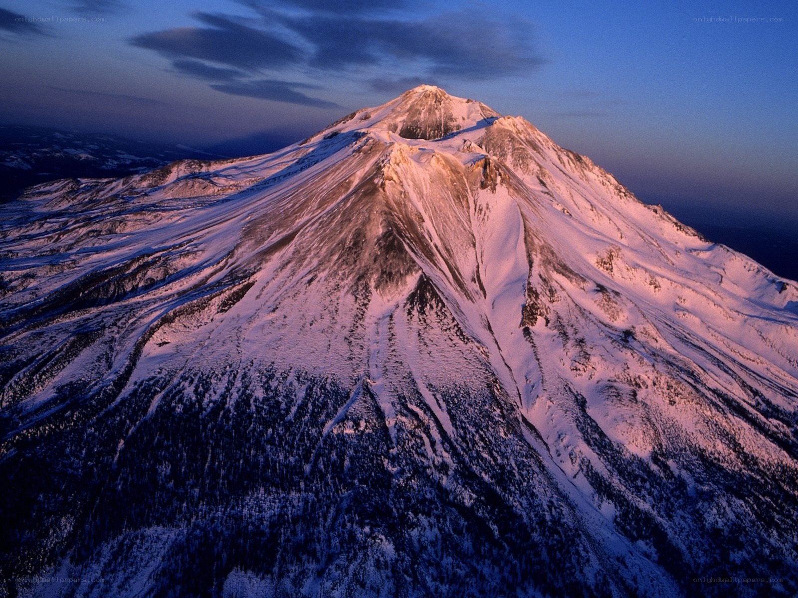 Snow-covered mountain at dawn