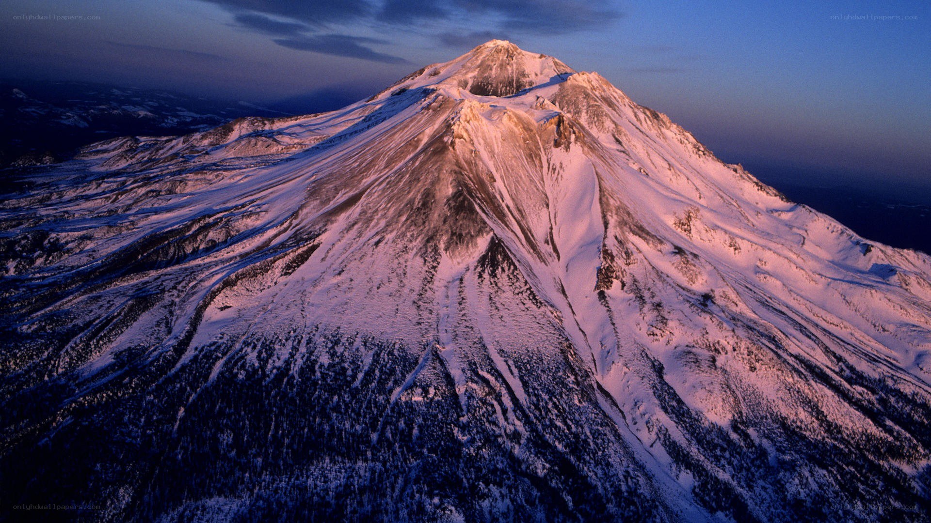 snow-covered mountain at dusk