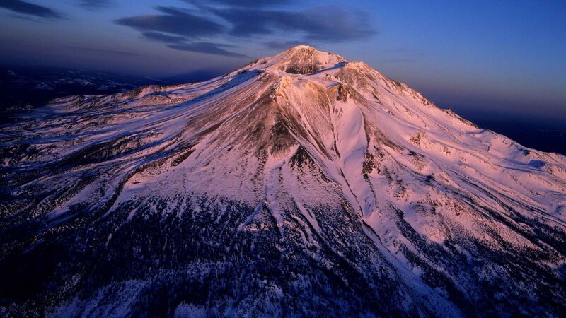 Snow-covered mountain at dusk