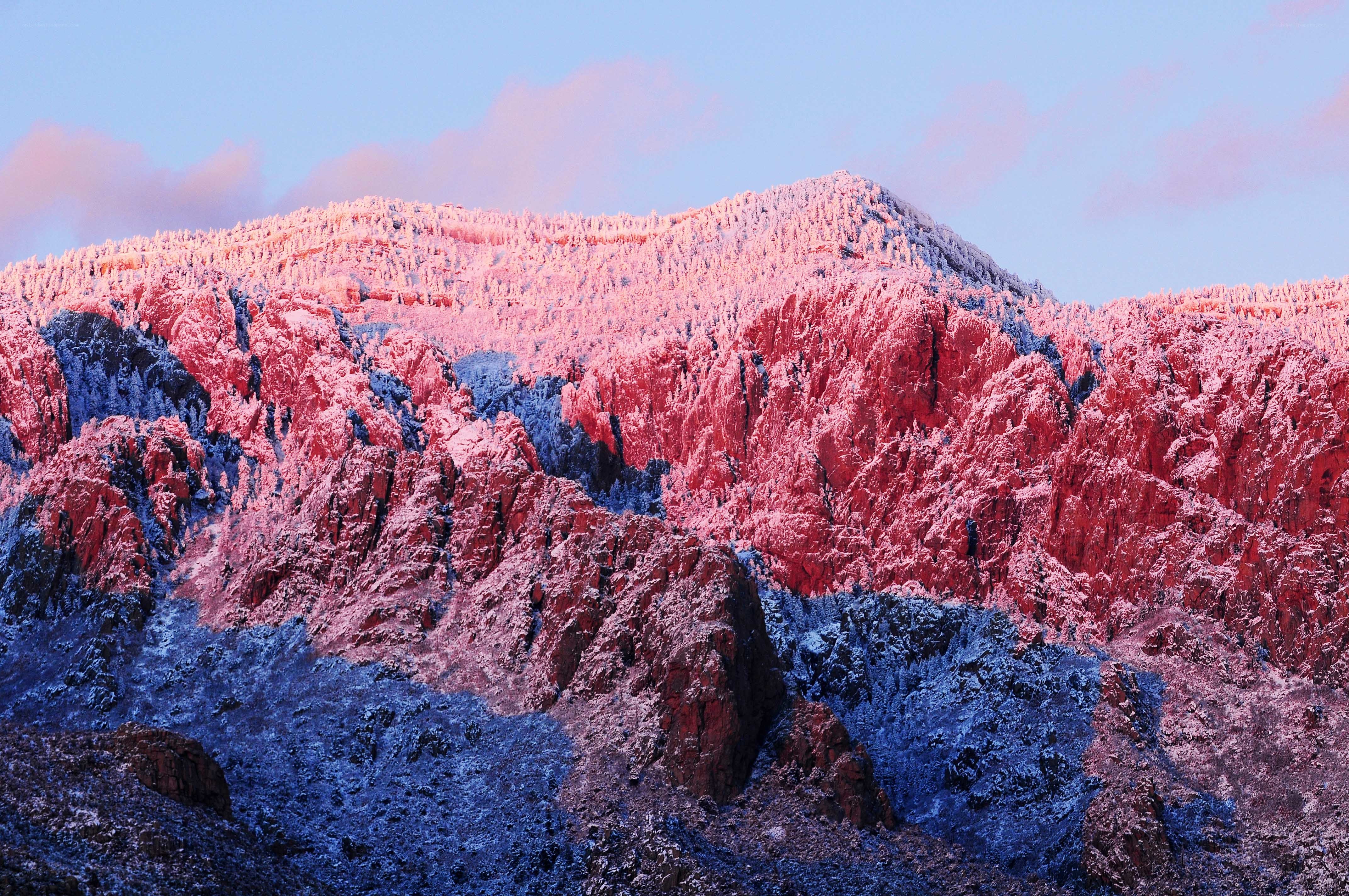 Snow-covered mountain at sunrise