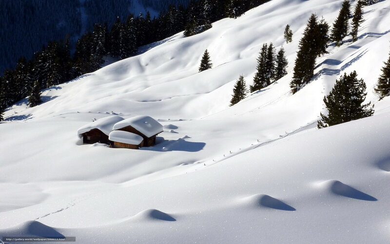 Snow-covered mountain cabin