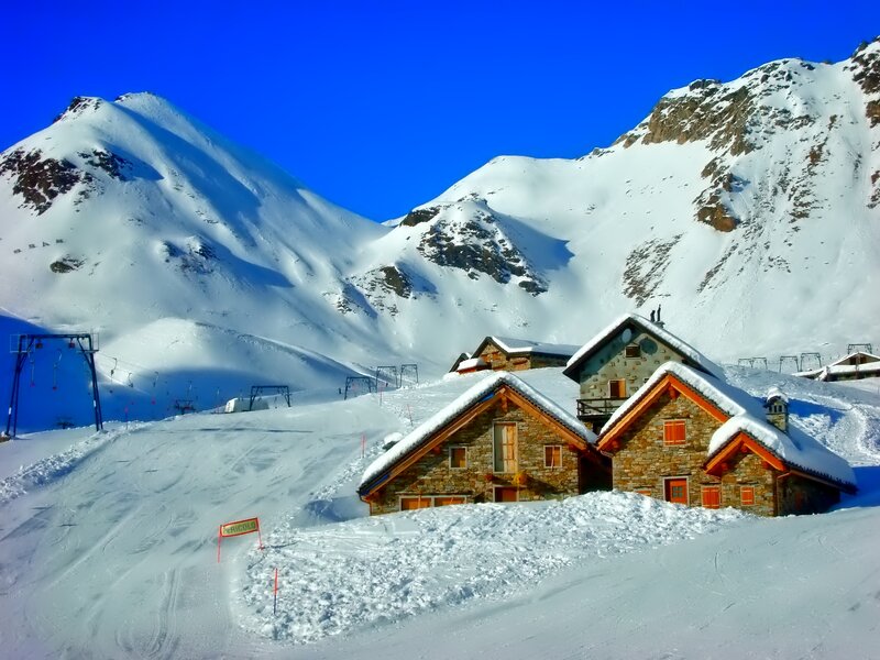 Snow-covered Mountain Cabins — Blue
