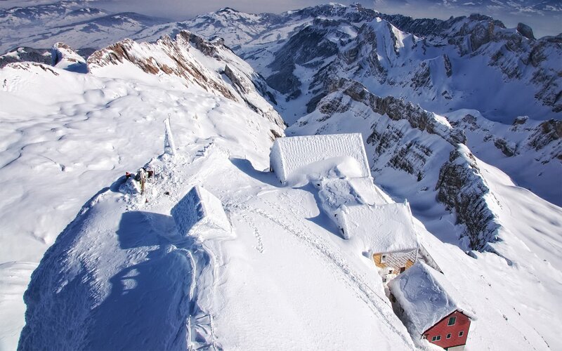 Snow-covered mountain hut