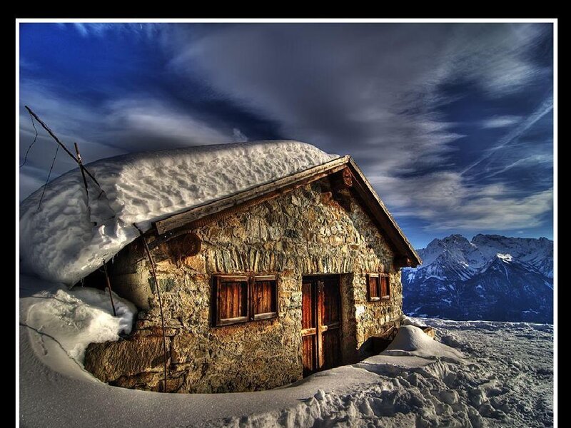 Snow-covered mountain hut
