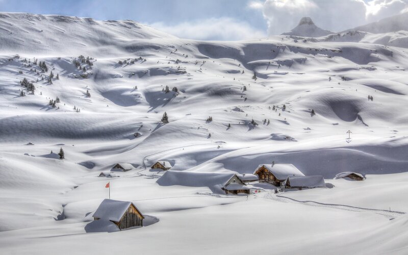 Snow-covered Mountain Huts — White