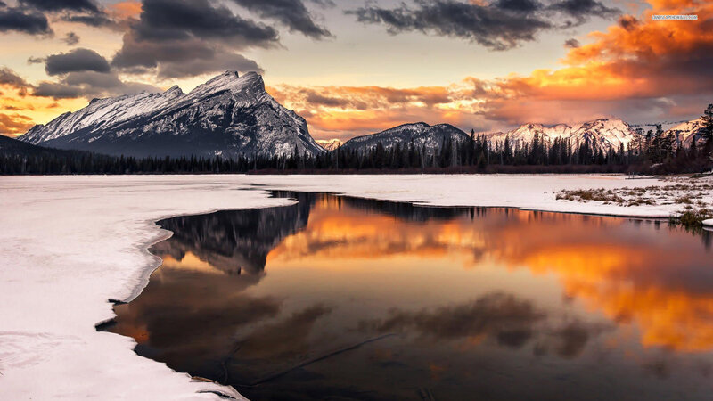 Snow-covered Mountain Lake — Orange, Dramatic
