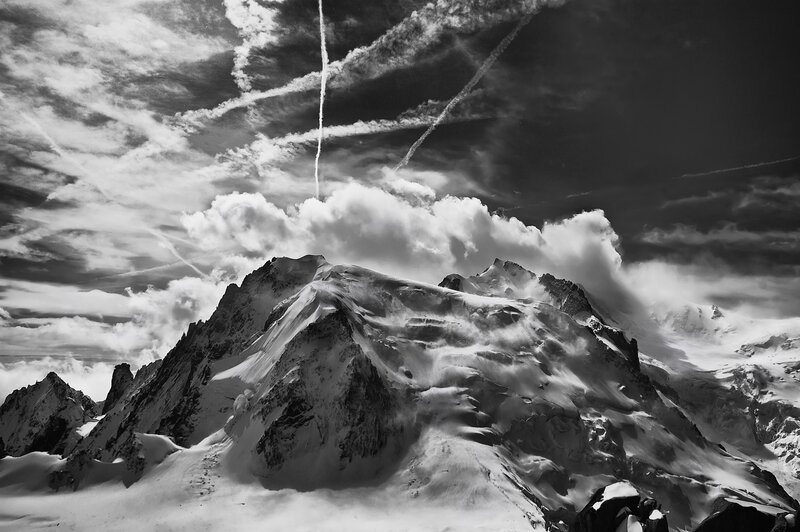 Snow-covered Mountain Peak — Black, Dramatic, Photograph, Clouds, Airplane Trails