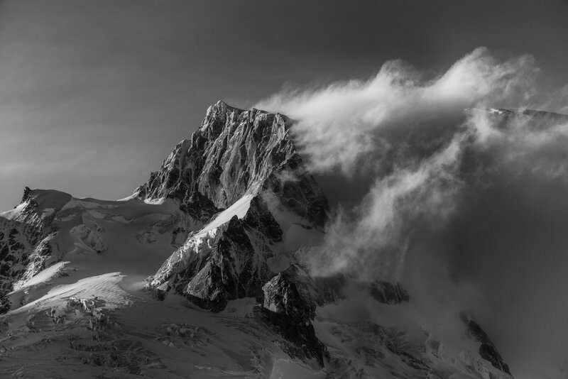 Snow-covered Mountain Peak — Black, Dramatic, Photograph, Clouds, Rock