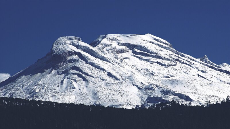 Snow-covered Mountain Peak — Blue, Dramatic, Afternoon, Photograph, Snow, Forest