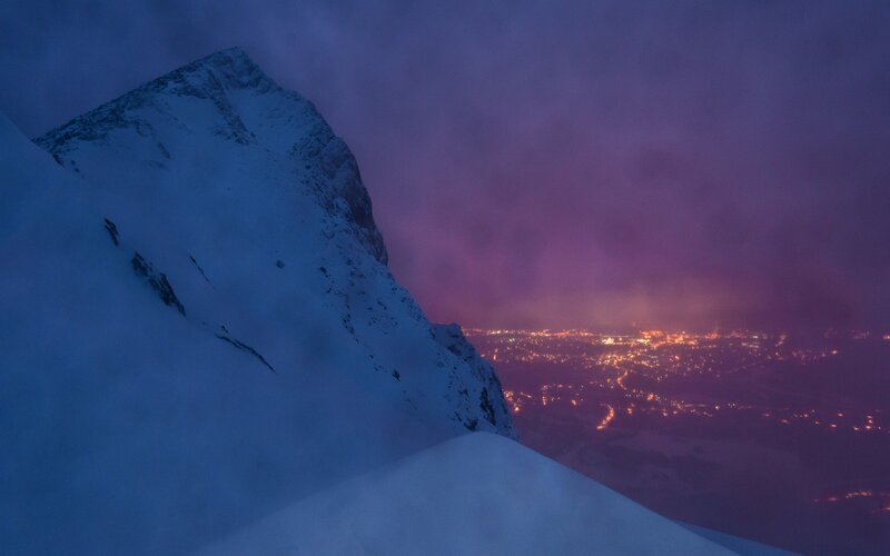 Snow-covered Mountain Peak — Blue, Dramatic, Night, Photograph, City Lights