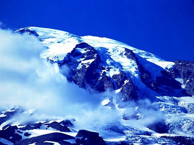 Snow-covered Mountain Peak — Blue, Dramatic, Photograph, Clouds, Rock, Glacier