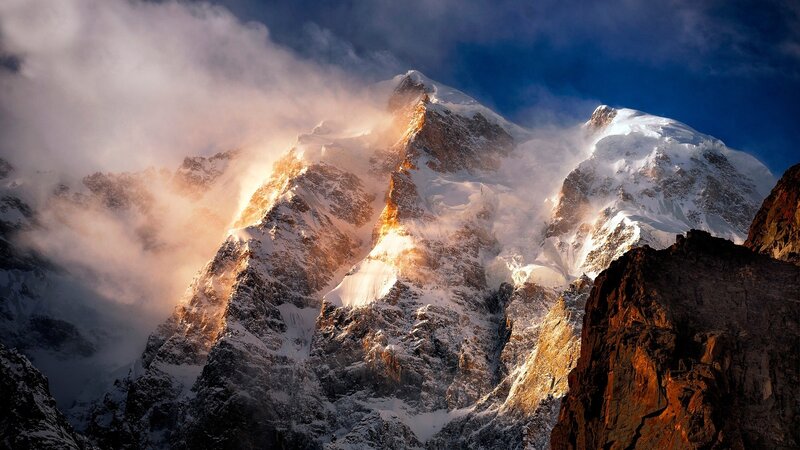 Snow-covered Mountain Peak — Blue, Dramatic, Sunrise, Photograph, Clouds, Rock, Sunlight