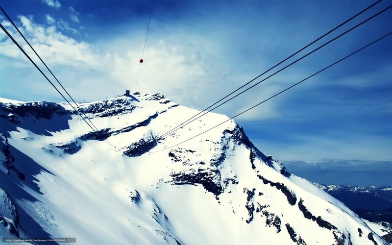 Snow-covered Mountain Peak — Blue, Dramatic, Winter, Photograph, Cable Car Lines, Sky, Clouds