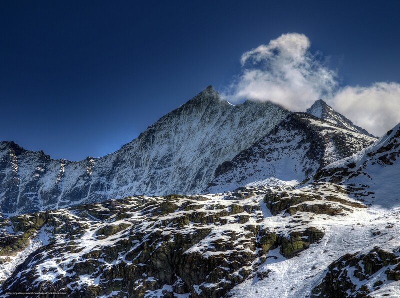 Snow-covered Mountain Peak — Blue, Dramatic, Winter, Photograph, Clouds, Rocky Terrain, Sky