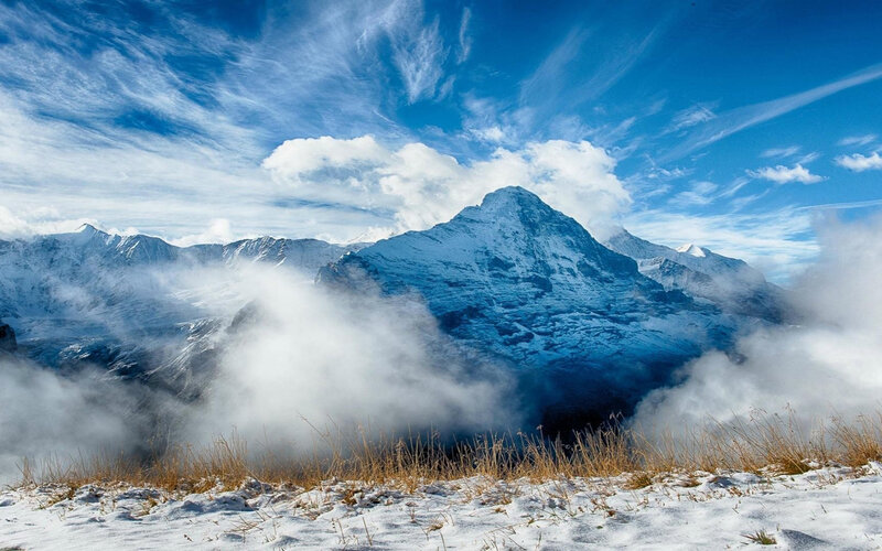 Snow-covered Mountain Peak — Blue, Dramatic, Winter, Photograph, Clouds, Sky, Grass