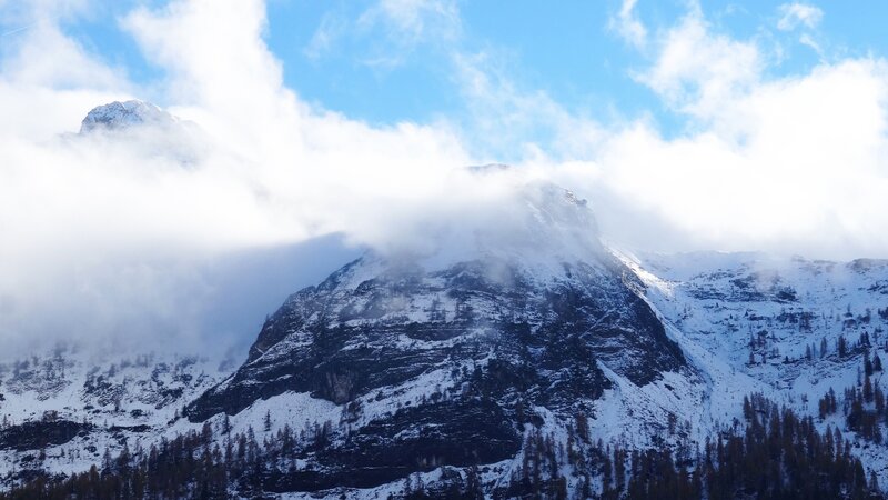 Snow-covered Mountain Peak — Blue, Dramatic, Winter, Photograph, Clouds, Trees, Sky