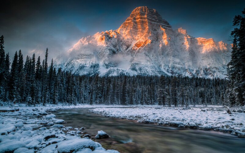Snow-covered Mountain Peak — Blue, Dramatic, Winter, Photograph, River, Forest