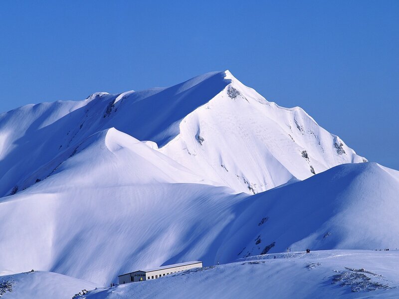 Snow-covered Mountain Peak — Blue, Serene, Winter, Photograph, Building, People
