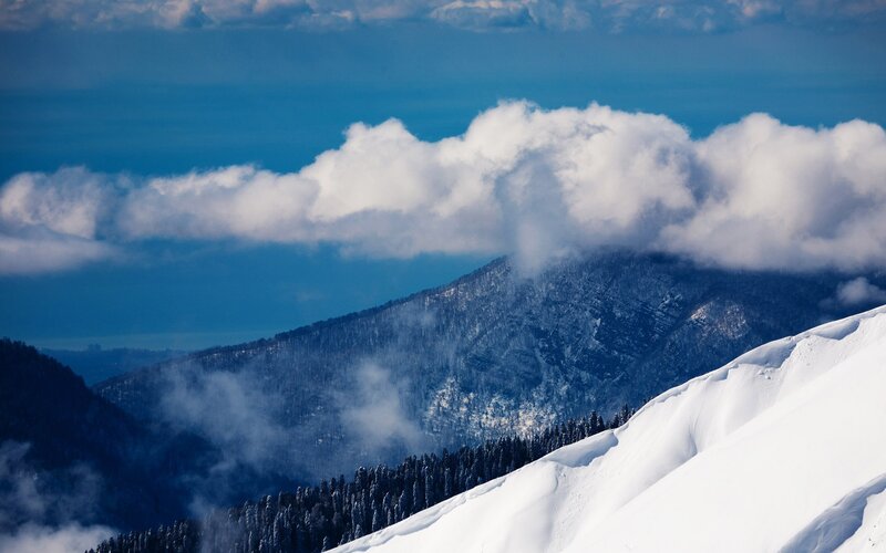 Snow-covered Mountain Peak — Blue, Serene, Winter, Photograph, Clouds, Forest