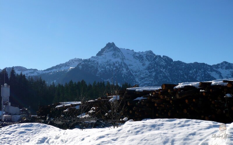 Snow-covered Mountain Peak — Blue, Serene, Winter, Photograph, Logs